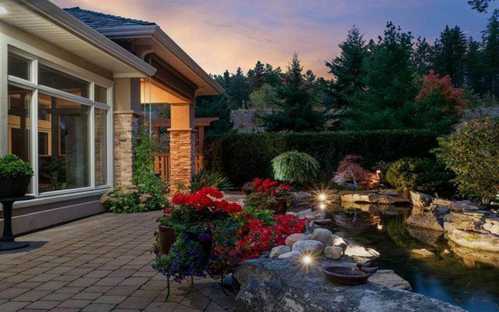 patio and pond with flower pots - landscaping design nanaimo