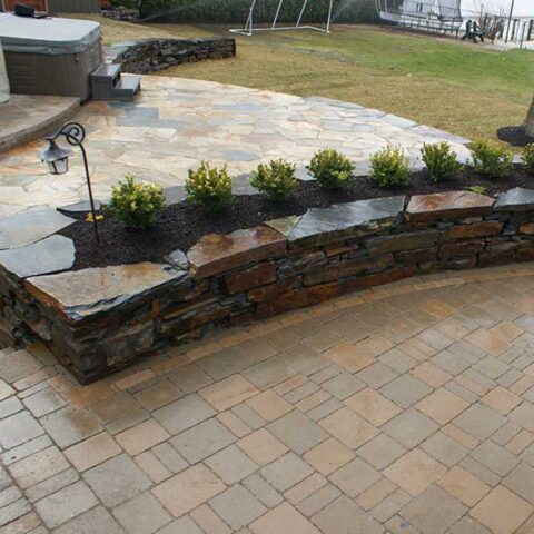 nanaimo raised planting bed with feature stack stone rock wall