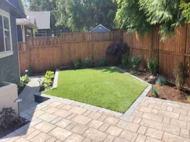 garden with artificial turf and paver edge
