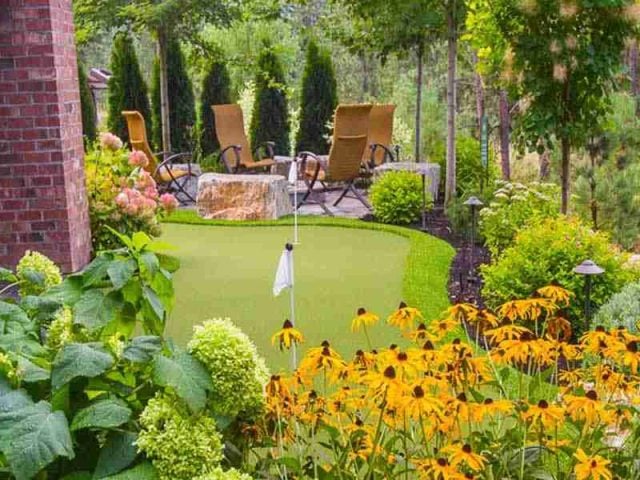putting green with fireplace seating - Fillinger Crescent landscape install