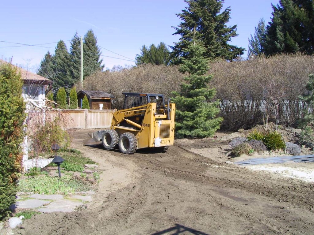 soil moving with skid steer - nanaimo excavation
